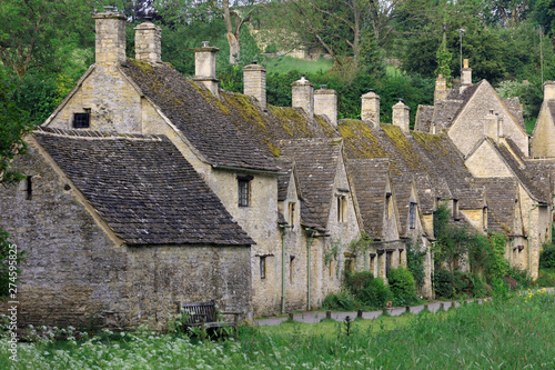 Row Of Old English Stone Cottages Set In The Cotswold Village Of Bibury. Cirencester. UK photo