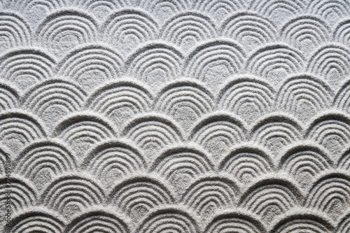 Photography Graphic wave patterns raked into the white sand of a Japanese Zen garden for a f