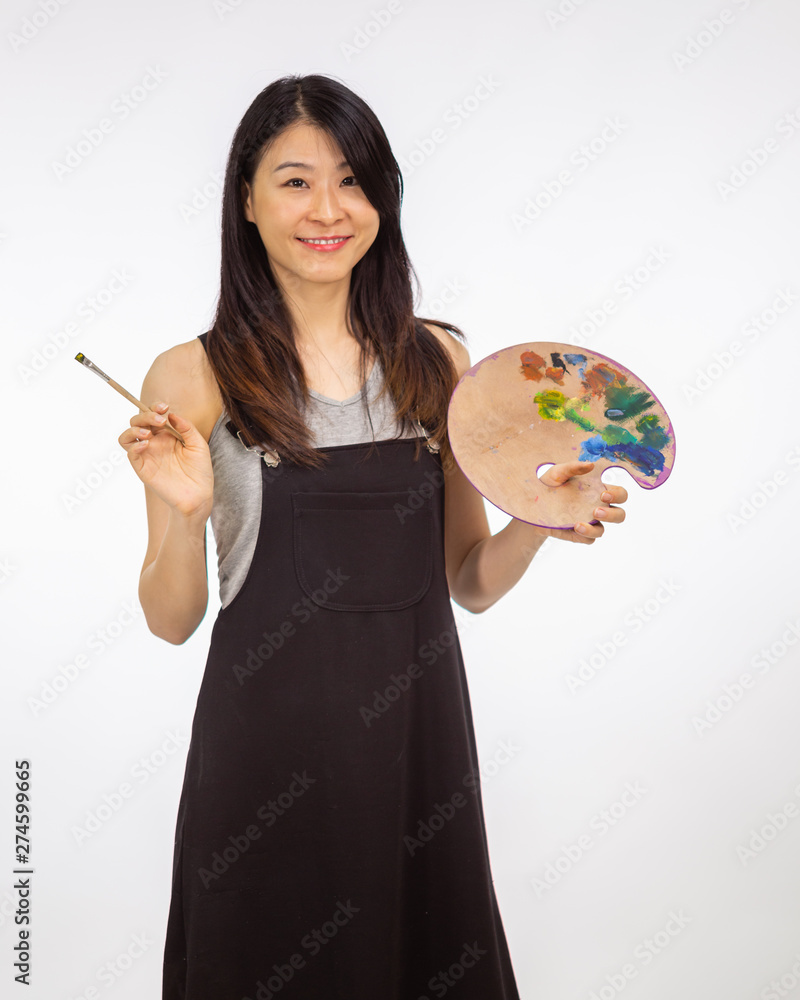 Fototapeta premium Artist holding painting palette and brush