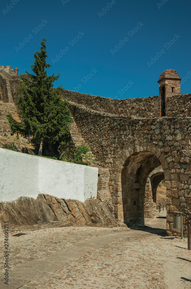 Arched gateway in the city outer wall made of stone