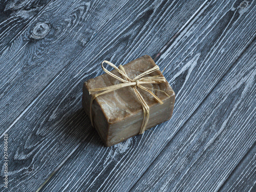 Olive oil soap handmade on a wooden background.