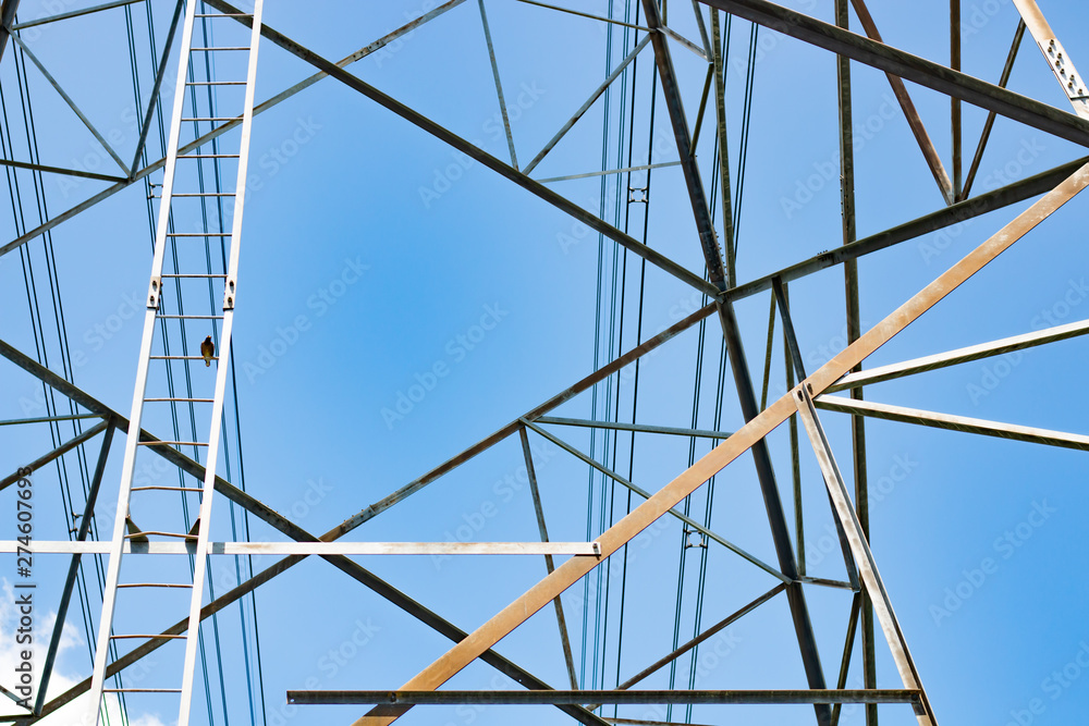 High voltage electric pole on sky background