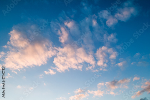 Blue sky and pink cloud with sun setting down. Cumulus cloud