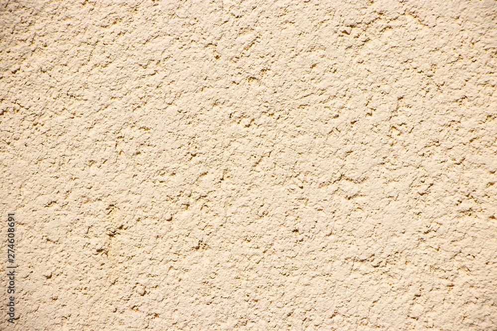 Beige painted grunge wall rough texture Beige painted grunge wall rough texture