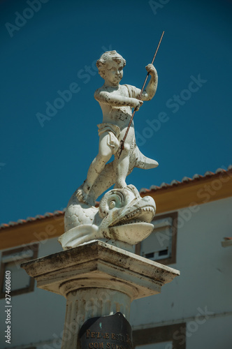 Curious marble statue on top of pillar