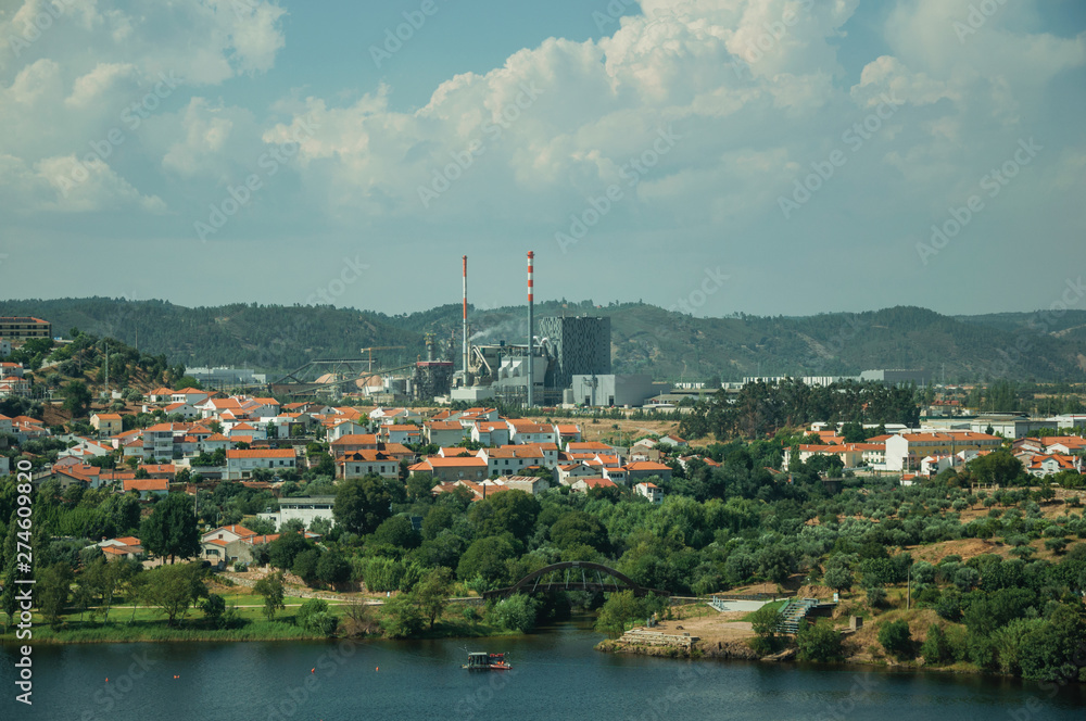 Wide Tejo River with pulp and paper industrial plant Wide Tejo River with pulp and paper industrial plant