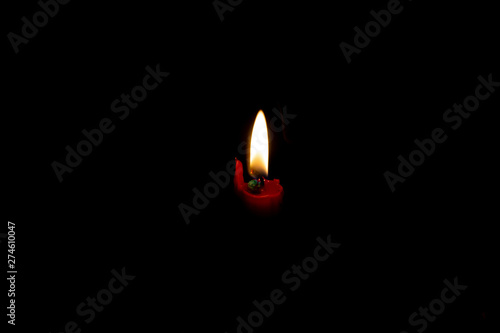 Light from the candle flame isolated on dark background