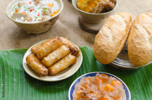 Vietnamese food background with spring roll, banh mi, banh canh, steamed fish ball, shrimp dumpling. Typical cuisine of south central of Vietnam like Binh Thuan, Ninh Thuan, Nha Trang province photo