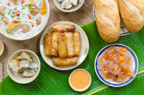 Vietnamese food background with spring roll, banh mi, banh canh, steamed fish ball, shrimp dumpling. Typical cuisine of south central of Vietnam like Binh Thuan, Ninh Thuan, Nha Trang province photo