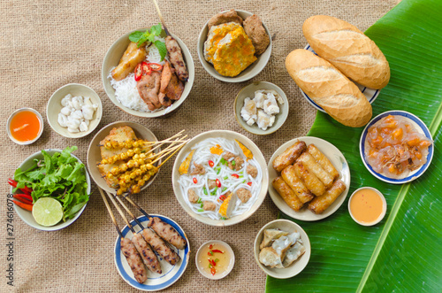 Vietnamese food background with spring roll, banh mi, banh canh, steamed fish ball, shrimp dumpling. Typical cuisine of south central of Vietnam like Binh Thuan, Ninh Thuan, Nha Trang province