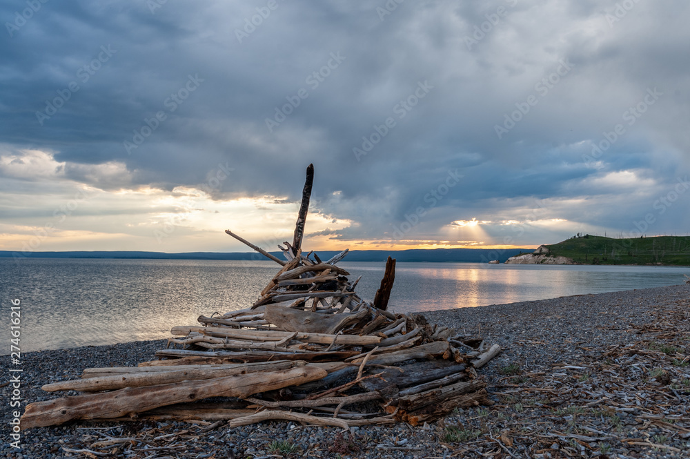 Impression of a wooden Tipi on the shores of Lake Yellowstone, around sunset.