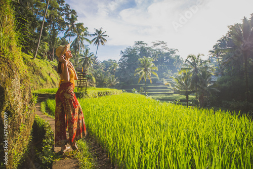 Wallpaper Mural Beautiful girl visiting the Bali rice fields in tegalalang, ubud. Concept about people, wanderlust traveling and tourism lifestyle Torontodigital.ca
