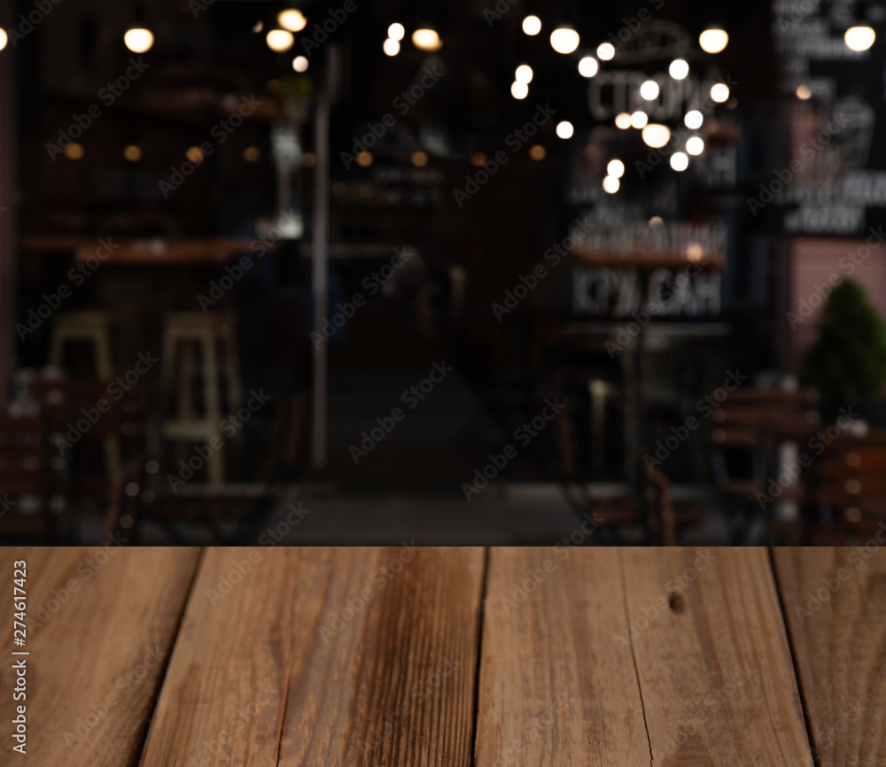 blurred cafe restaurant club background with wooden table blurred cafe restaurant club background with wooden table
