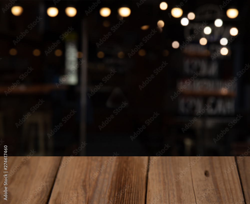 blurred cafe restaurant club background with wooden table