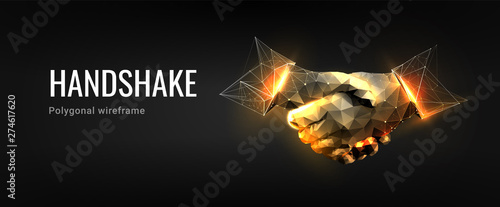 Handshake.Polygonal wireframe composition. Technology and innovation in bussines. Abstract illustration isolated on dark background. Particles are connected in a geometric silhouette.