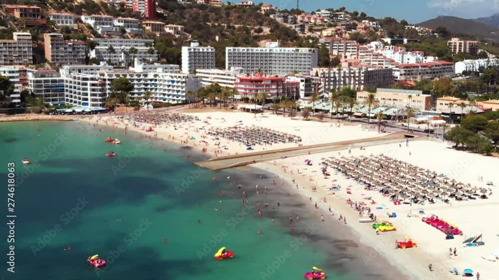 Aerial shot of the Santa Ponsa beach in Mallorca full of people. Aerial shot of the Santa Ponsa beach in Mallorca full of people.