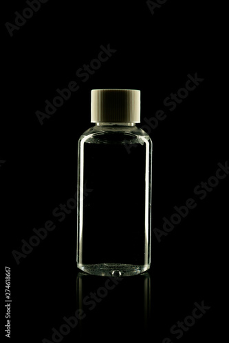 Cosmetic product bottle for cream, foam, shampoo on black background