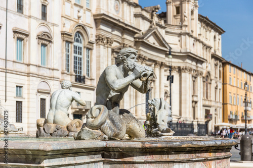 Detail sculpture of a triton, greek God. The Moor Fountain (Italian: Fontana del Moro) in Navona Square, Rome, Italy.