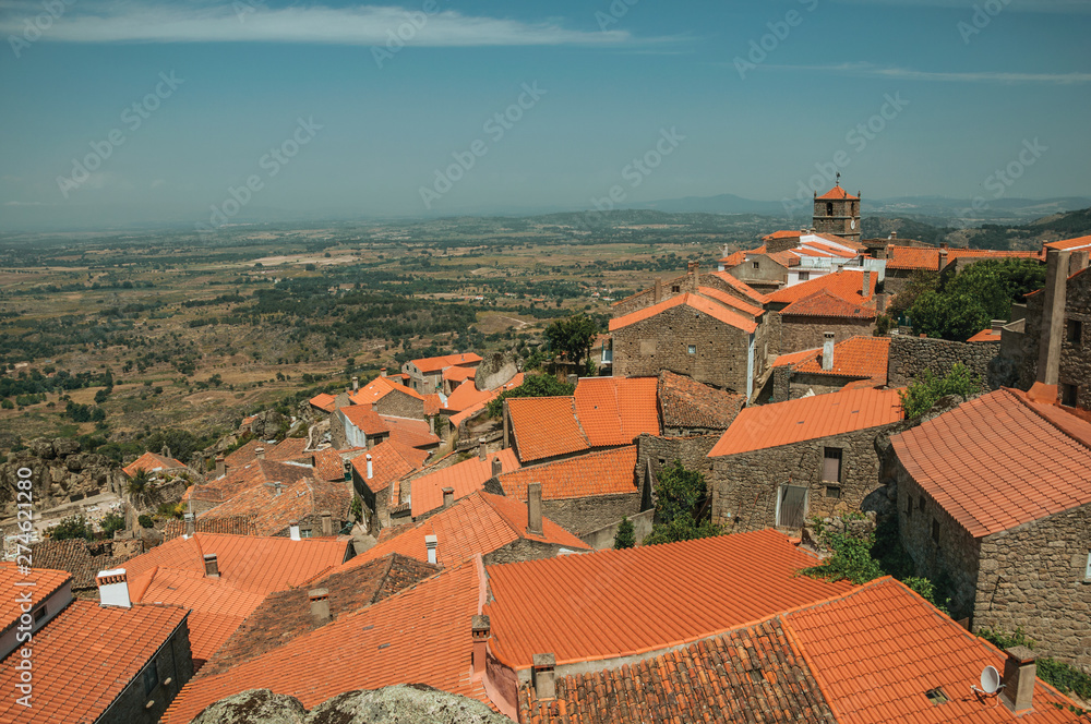 Rooftops of old houses with church steeple in Monsanto