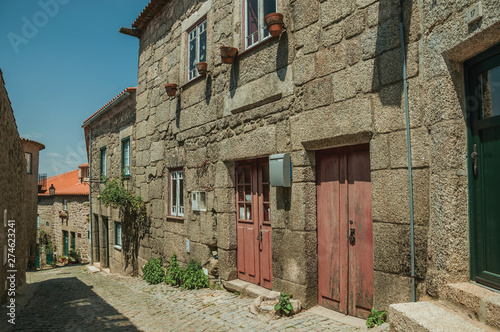 Old stone houses in alley on slope at Monsanto