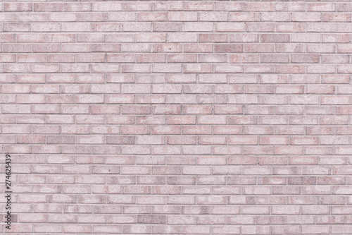 Brick wall in light pink grey color for background use.