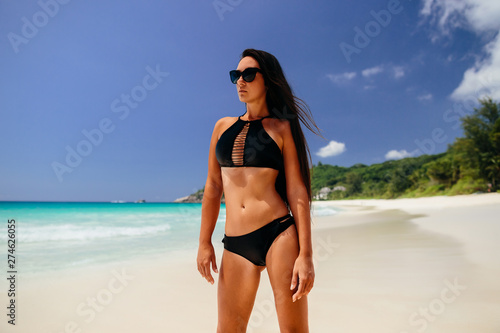 luxury woman relax on beach of tropical island