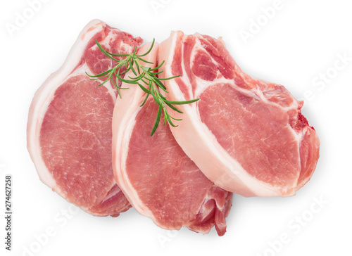 sliced raw pork meat with rosemary isolated on white background. Top view. Flat lay