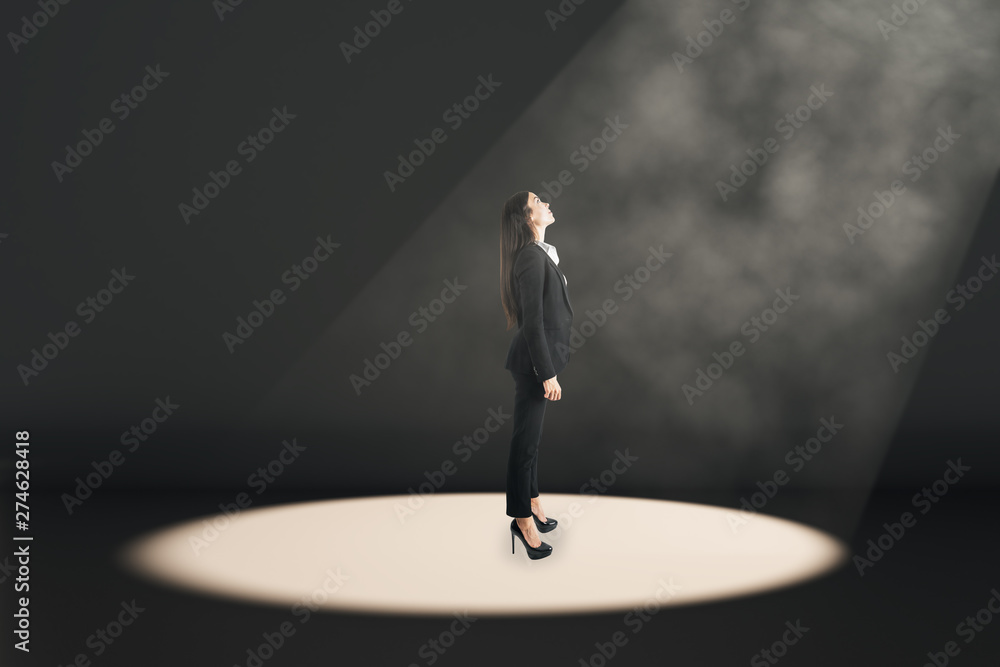 Fototapeta premium Businesswoman in spot light