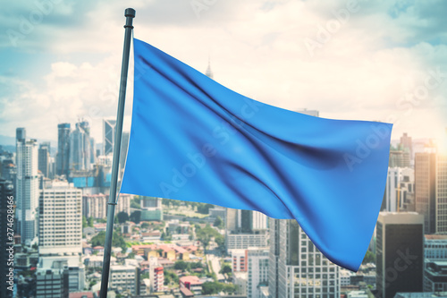 Empty blue flag in city