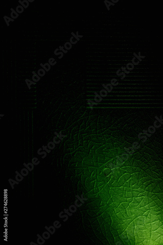 Fototapeta Naklejka Na Ścianę i Meble -  On a background with a pattern a short beam of green