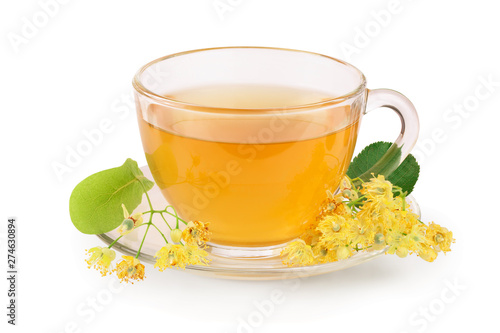 Tea from Linden flowers in glass cup with flower clusters of lime isolated on white background