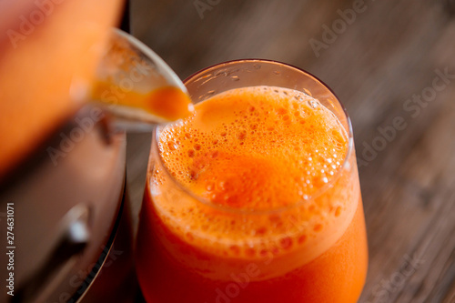process of making juice in a juicer, process preparation of fresh juice in juicer, carrot juice