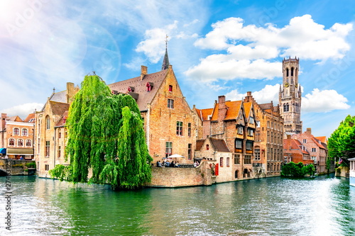 Rozenhoedkaai canal and Belfort tower, Bruges, Belgium photo