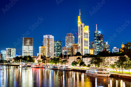 Skyline of Frankfurt with the river Main at night