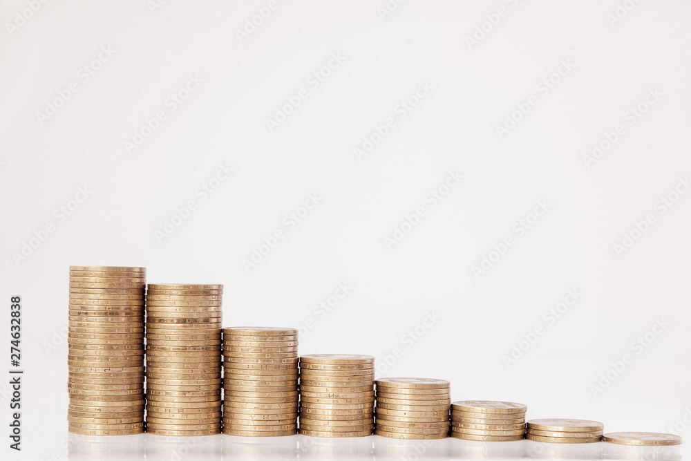 Coins in the form of a histogram on a white background. Concept of lending, savings, insurance. Coins in the form of a histogram on a white background. Concept of lending, savings, insurance.