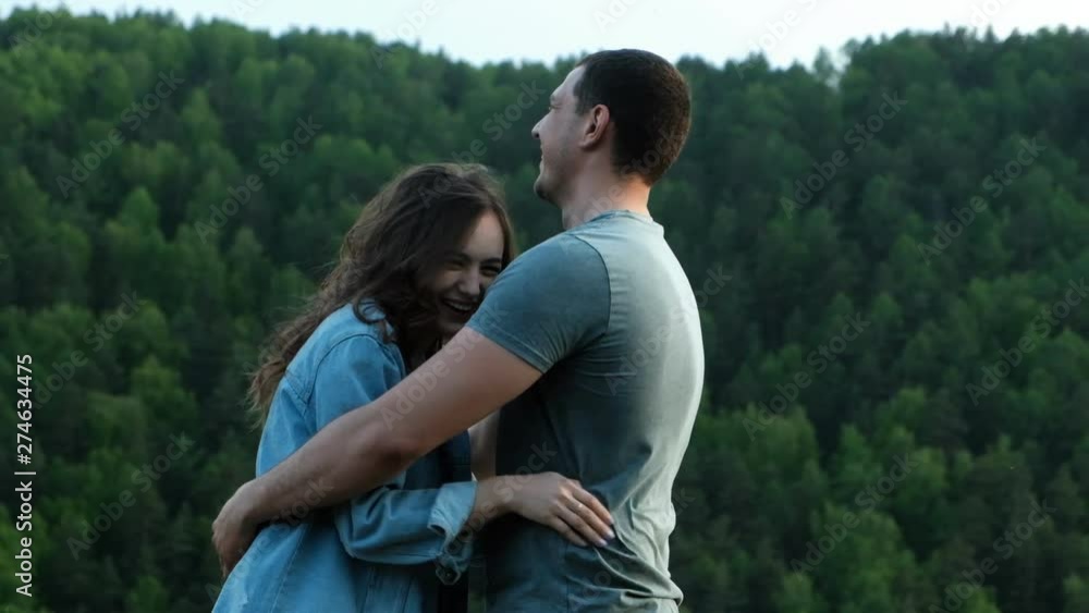 A man ruffling his girlfriend's hair. Young couple having fun. A man ruffling his girlfriend's hair. Young couple having fun.