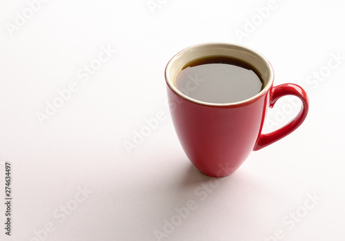 Black coffee in a red mug