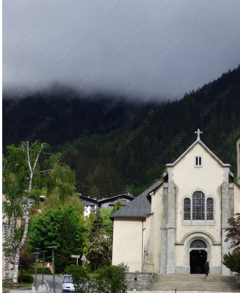 Church in Chamonix, France with an ominous looking bank of fog hanging over it.