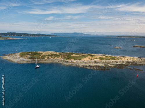 Island with sailboat in front