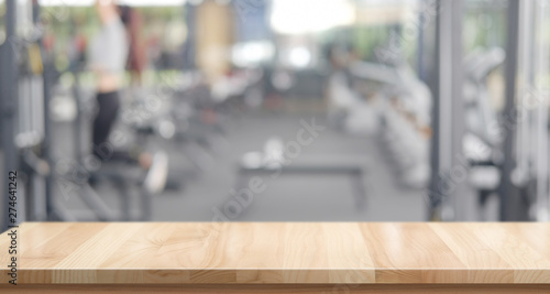 Empty wood table space platform and fitness gym background photo