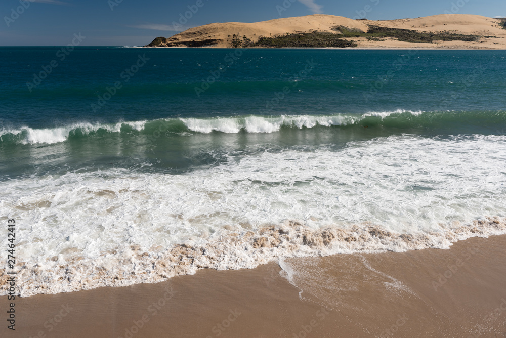Massive sand dunes at the head of the Hokianga Harbour, viewed from Opononi, Northland, New Zealand.