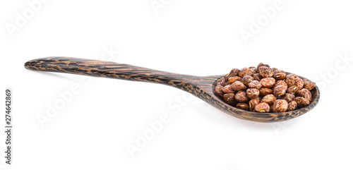 Nuts seed in wood spoon isolated on white background