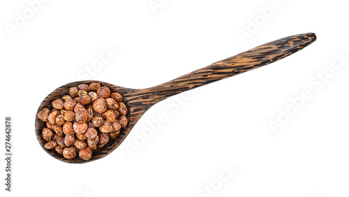 Nuts seed in wood spoon isolated on white background