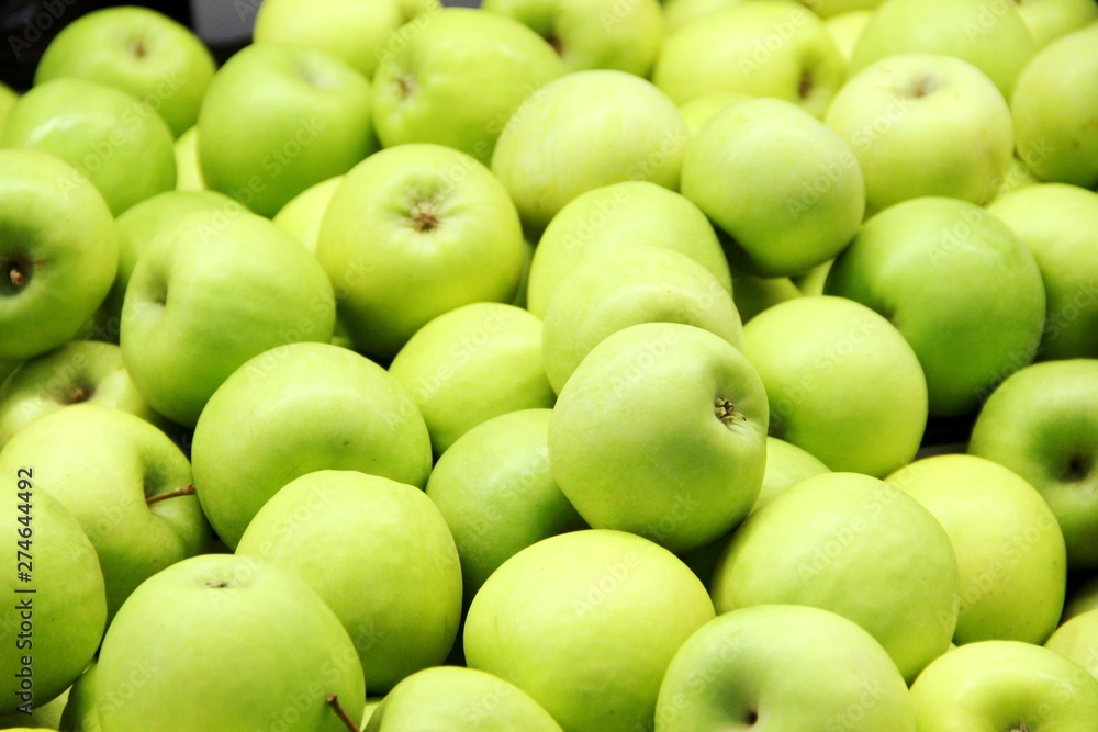 lots of green apples in the box, background. Good harvest. lots of green apples in the box, background. Good harvest.
