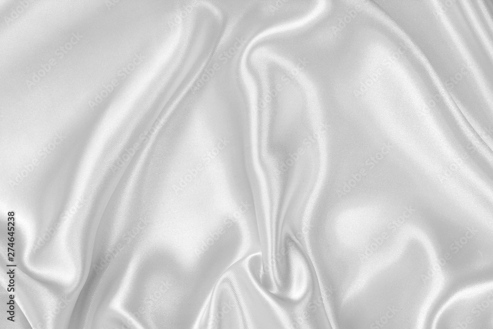 The texture of the satin fabric of white color for the background The texture of the satin fabric of white color for the background