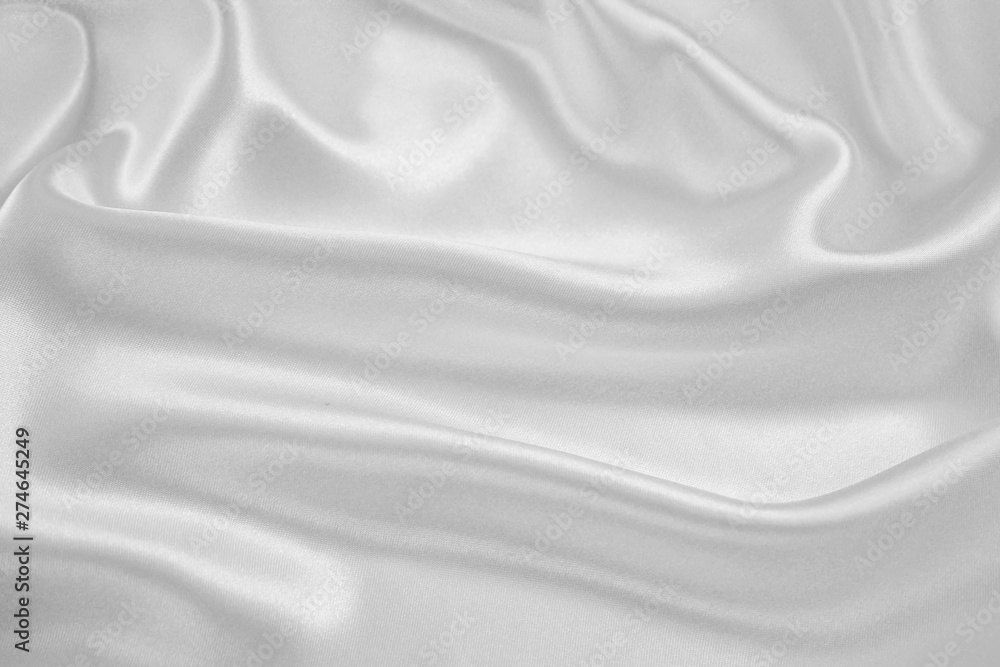 Fototapeta premium The texture of the satin fabric of white color for the background