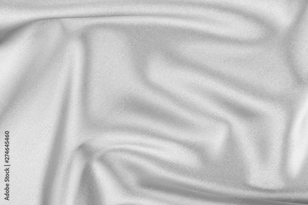 The texture of the satin fabric of white color for the background The texture of the satin fabric of white color for the background