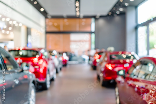 blur view of new modern car in showroom photo