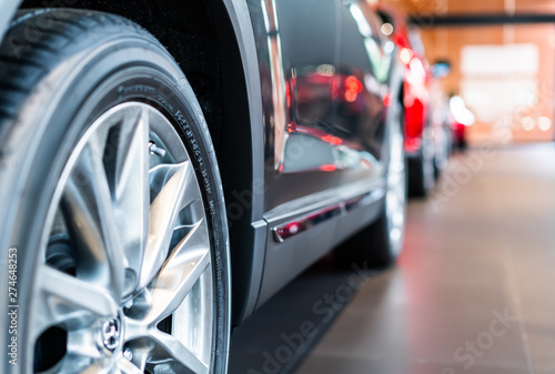 blur view of new modern car tire in showroom © voyata