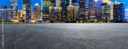 Photography Shanghai modern commercial buildings and empty asphalt road at night